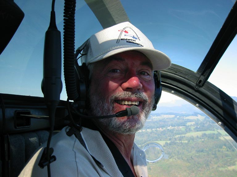 Charlie Duchek in helicopter cockpit