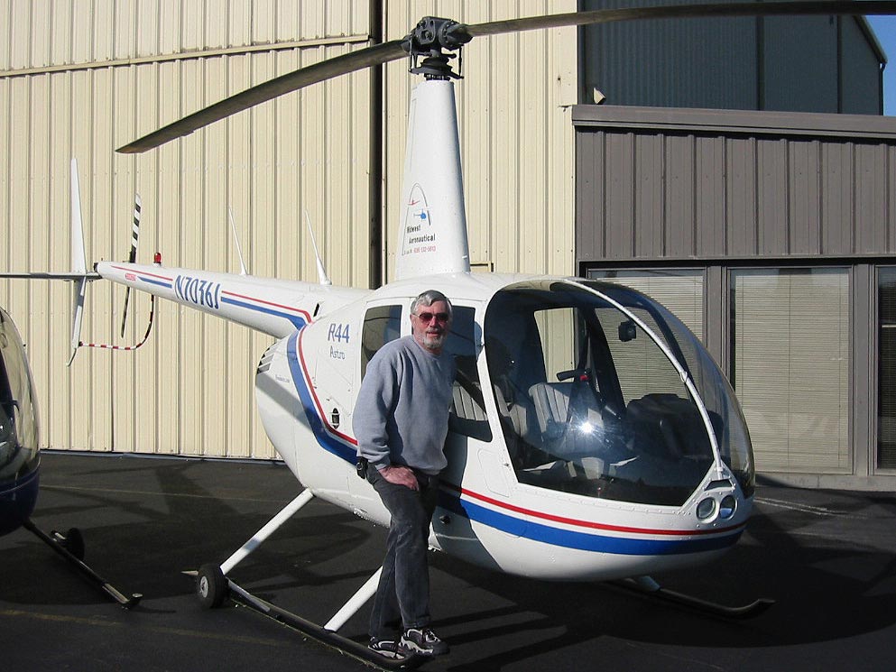 Charlie Duchek with Robinson R44 Helicopter
