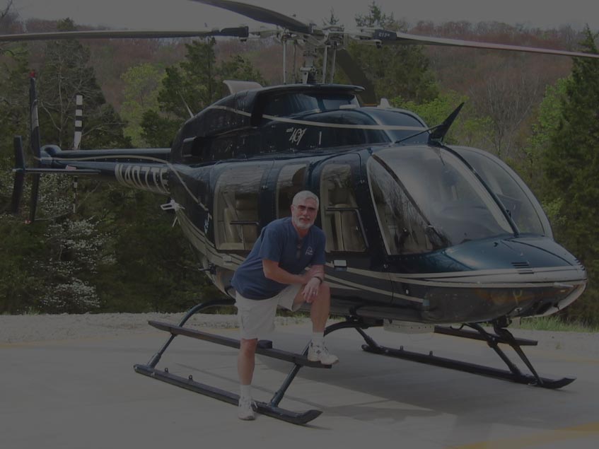 Charlie Duchek with Bell 407 jet helicopter